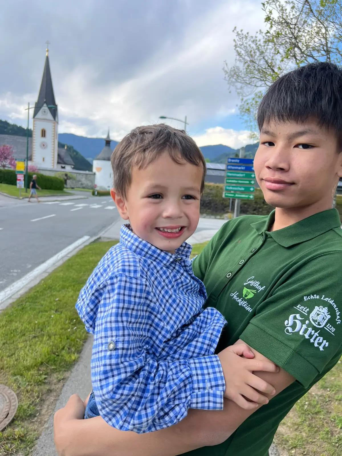 The Glabisch family’s sons in front of the church in Glödnitz